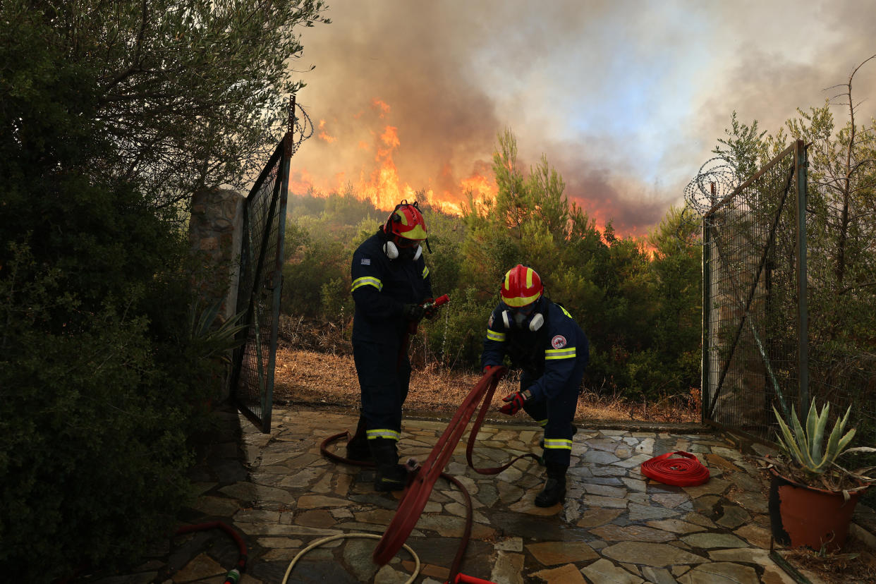 STAMATA, GREECE - JUNE 30: Firefighters try to extinguish a wildfire in Stamata region near Athens, Greece on June 30, 2024. (Photo by Costas Baltas/Anadolu via Getty Images)