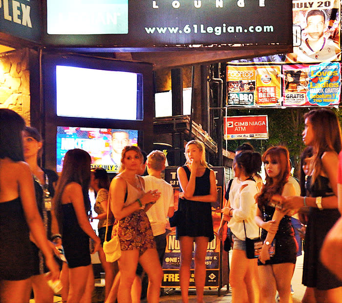 Dress to party: Ladies on the Legian street looking to enter a bar. Even though sleeveless shirts and sandals are common, it wouldn't hurt to look nice too. (