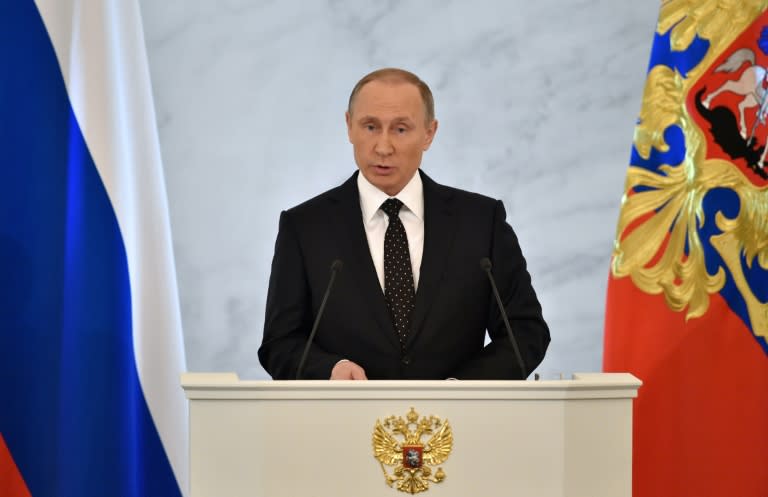 Russian President Vladimir Putin delivers his annual state of the nation address at the Kremlin in Moscow on December 3, 2015