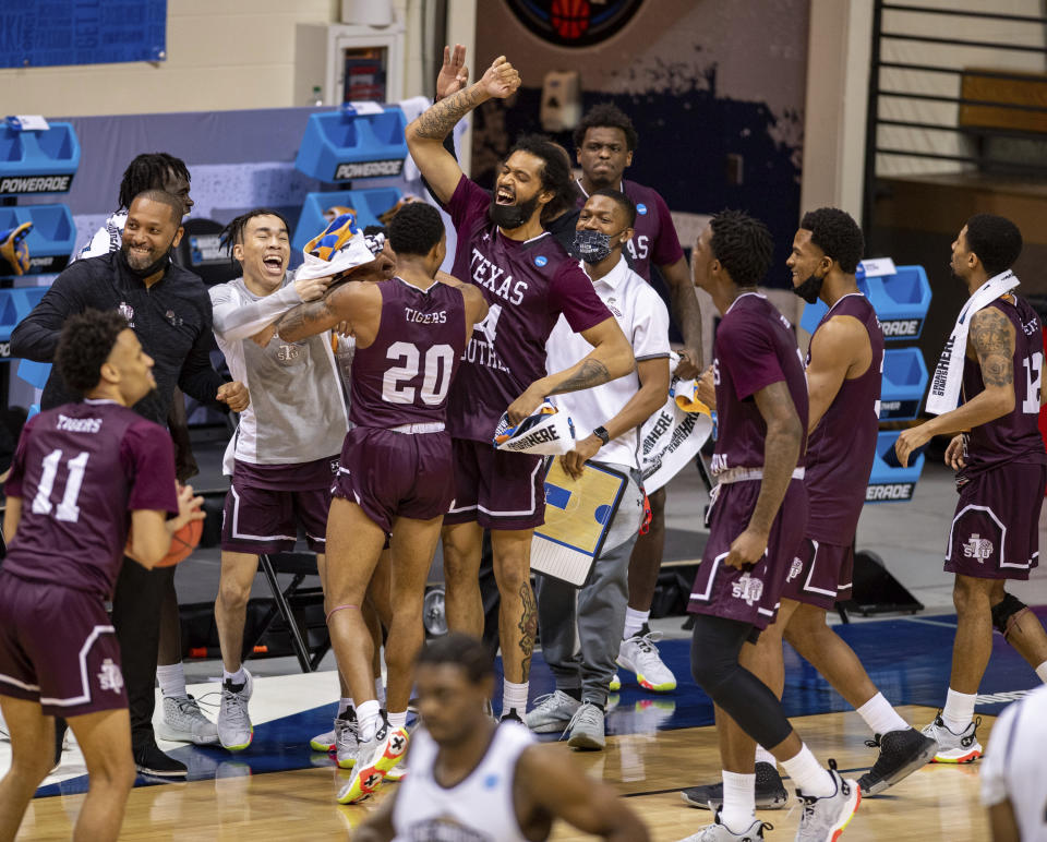 Texas Southern players celebrate after defeating Mount St. Mary's in a First Four game in the NCAA men's college basketball tournament, Thursday, March 18, 2021, in Bloomington, Ind. (AP Photo/Doug McSchooler)