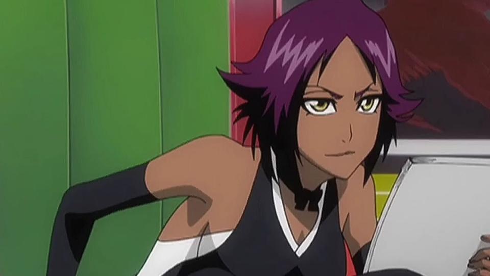 Yoruichi from Bleach sits with a notepad in her hans