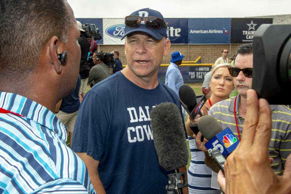 FILE - In this July 28, 2018, file photo, Dallas Cowboys offensive coordinator Scott Linehan talks with the media after morning practice at NFL football training camp, in Oxnard, Calif. Scott Linehan is out as offensive coordinator of the Dallas Cowboys only days after coach Jason Garrett sent mixed messages about the oft-criticized assistant's future. Garrett said in a statement released by the team Friday, Jan. 18, 2019, that he and Linehan had some open discussions this week and mutually agreed that a change was needed after five seasons. (AP Photo/Gus Ruelas, File)