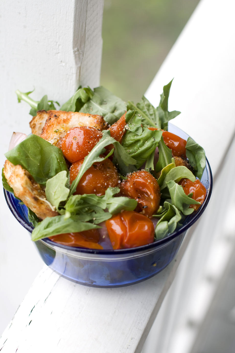 In this image taken on June 10, 2013, a grilled bread and tomato salad is shown served in a bowl in Concord, N.H. (AP Photo/Matthew Mead)