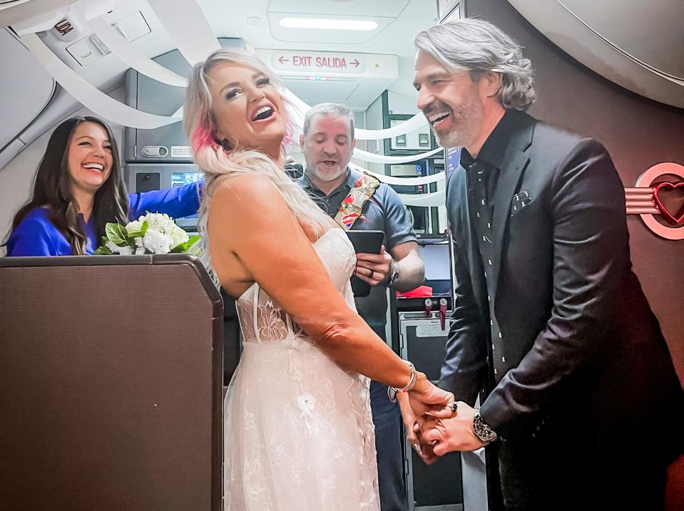 Photos from Pam and Jeremy Salda's  in-flight wedding, after a flight cancelation made them miss their elopement to Las Vegas. Photos provided.