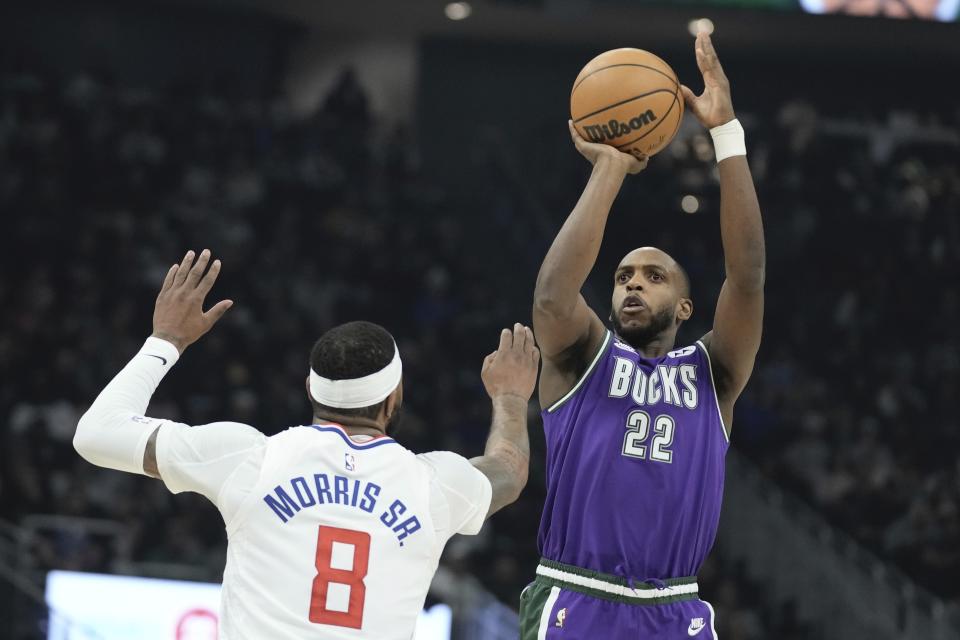 Milwaukee Bucks' Khris Middleton shoots past Los Angeles Clippers' Marcus Morris Sr. during the first half of an NBA basketball game Thursday, Feb. 2, 2023, in Milwaukee. (AP Photo/Morry Gash)