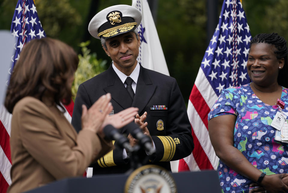 Vice President Kamala Harris looks to Surgeon General Vivek Murthy, center, and Monique Cauley of the Children's National Hospital staff, right, as she speaks at Children's National Hospital, Monday, May 23, 2022, about mental health and wellness. (AP Photo/ Carolyn Kaster)