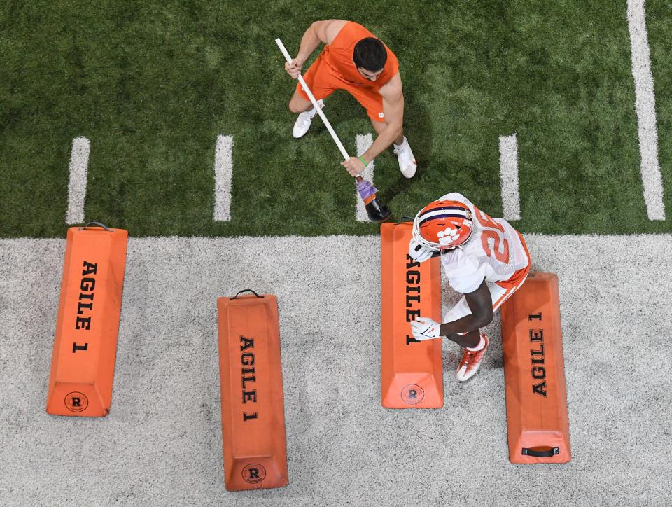 Clemson running back Will Shipley (1) jabs with a boxing glove on a stick at running back Phil Mafah (26) in a drill during Spring practice in Clemson, S.C. Monday, March 7, 2022. 