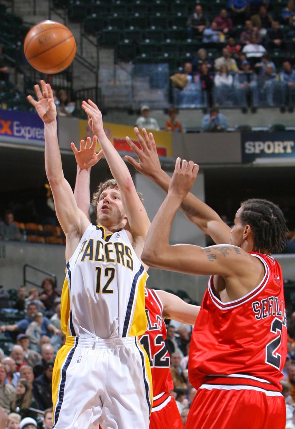Travis Diener (12), shown against the Bulls in 2008, saw his playing time decrease each year with the Pacers.