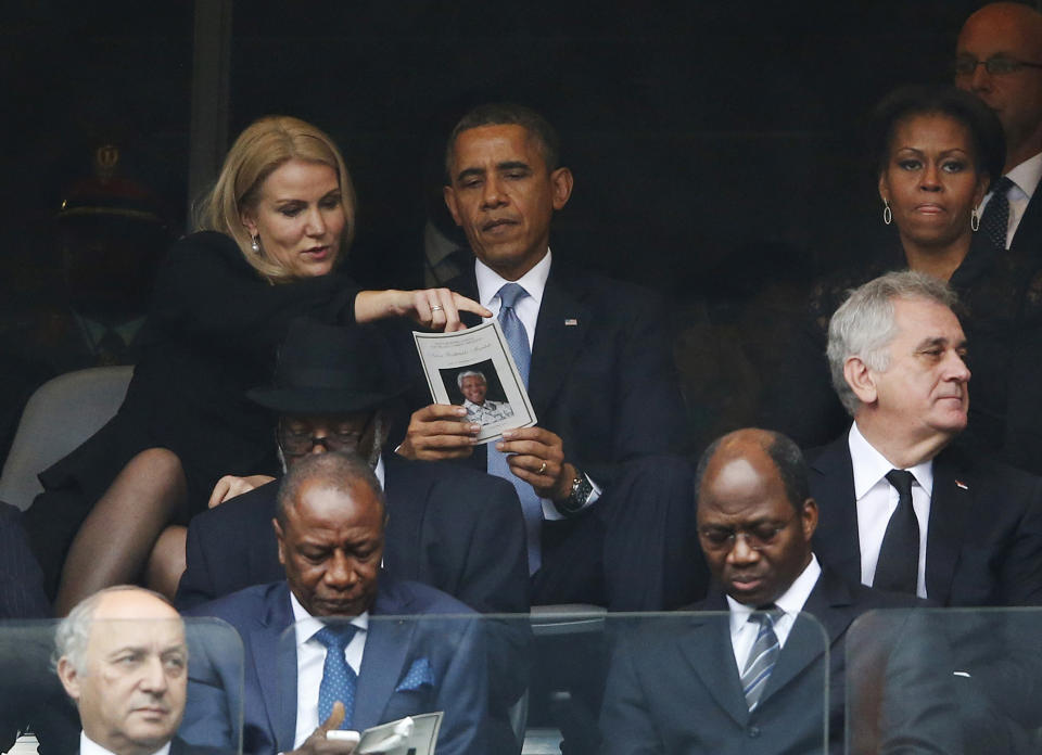 FILE - US President, Barack Obama, attends a memorial service for the late Nelson Mandela, in Soweto, Johannesburg, South Africa, on Dec. 10, 2013. The South African government announced Friday Jan 19, 2024 that it plans to challenge an auction of artifacts which belonged to Mandela, set to take place in New York next month. (AP Photo/Matt Dunham, File)