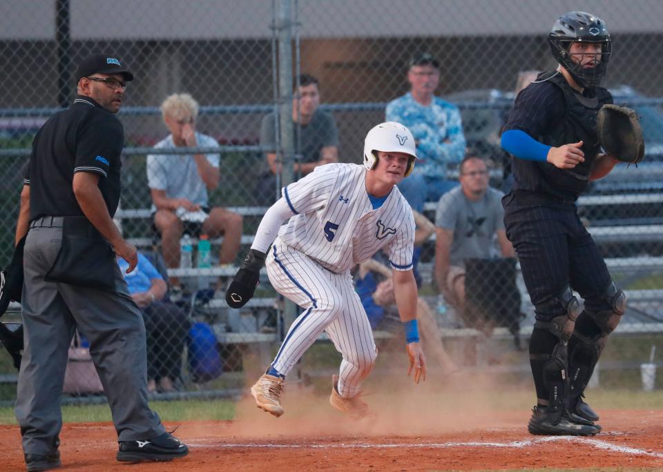 Lakeland Christian's Zach Lester slides safely into home against Mount Dora Christian on Saturday night in the Class 2A, Region 2 semifinals at LCS.