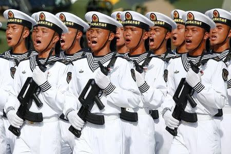 Troops shout as they prepare for the arrival of Chinese President Xi Jinping (unseen) at the People's Liberation Army (PLA) Hong Kong Garrison as part of events marking the 20th anniversary of the city's handover from British to Chinese rule, in Hong Kong, China June 30, 2017. REUTERS/Damir Sagolj