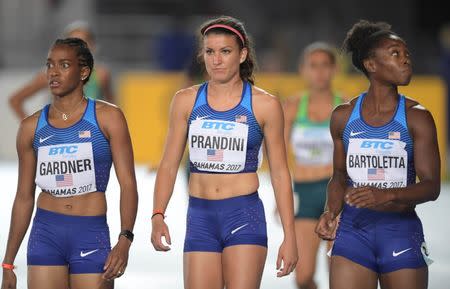 Apr 23, 2017; Nassau, Bahamas; English Gardner (left), Jenna Prandini (center) and Tianna Bartoletta react after the United States women's 4 x 100m relay failed to finish during the IAAF World Relays at Thomas A. Robinson Stadium. Mandatory Credit: Kirby Lee-USA TODAY Sports