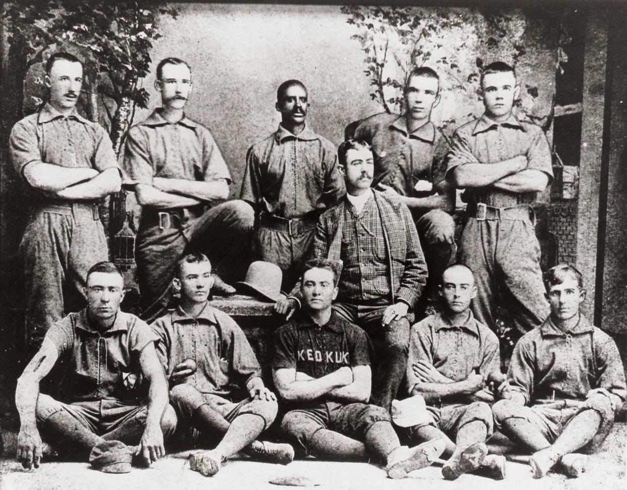 Bud Fowler, center, was a Black baseball star in the 19th century who played organized baseball against white players before the sport established its racist color line. Here, he appears with his team from Keokuk, Iowa.