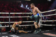 Canelo Alvarez knocks down Jaime Munguia in a super middleweight title fight Saturday, May 4, 2024, in Las Vegas. (AP Photo/John Locher)