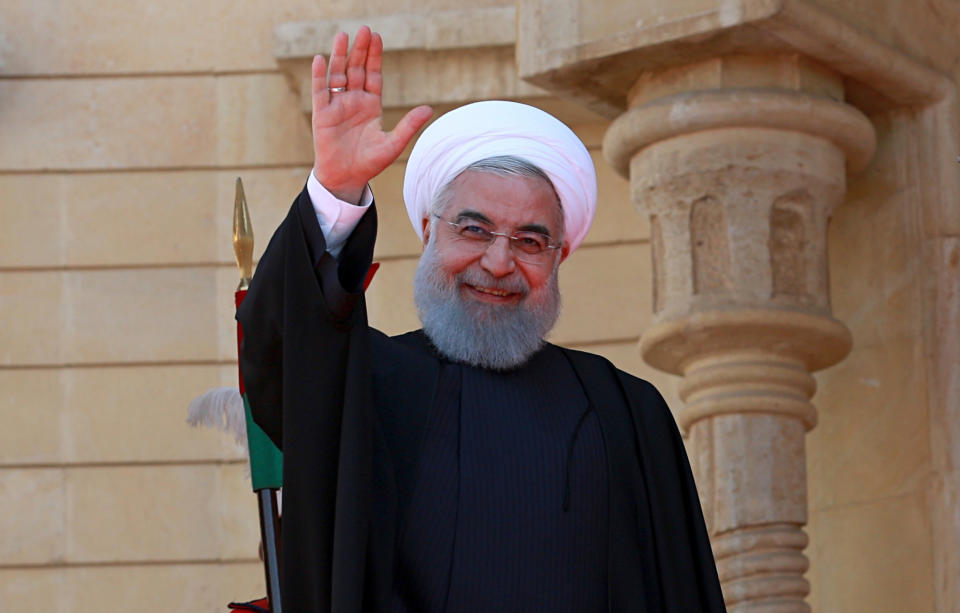 Iranian President Hassan Rouhani waves to journalists before his meeting with his Iraqi counterpart Barham Salih at Salam Palace in Baghdad, Iraq, Monday, March 11, 2019. Rouhani is visiting Iraq, seeking to boost ties between the two neighboring states and possibly secure Iraq’s help in bypassing U.S. sanctions the Trump administration re-imposed last year. (AP Photo/Khalid Mohammed)