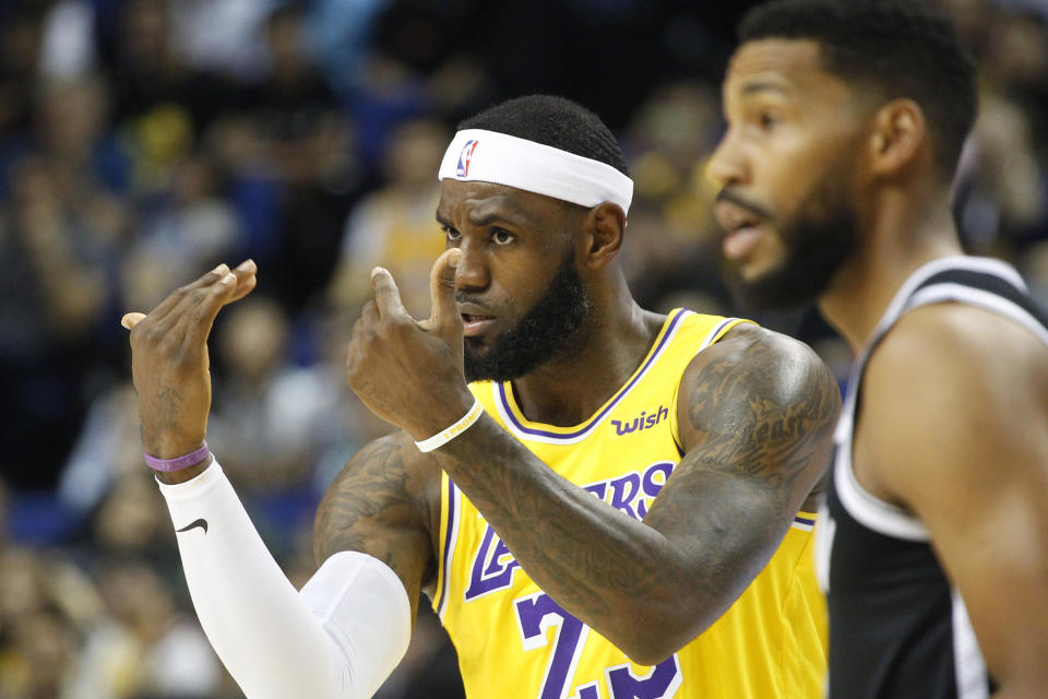 Los Angeles Lakers' Lebron James gestures during a preseason NBA game against the Brooklyn Nets in Shanghai, China, Thursday, Oct. 10, 2019. All of the usual media sessions surrounding the Lakers-Nets preseason game in Shanghai on Thursday — including a scheduled news conference from NBA Commissioner Adam Silver and postgame news conferences with the teams — were canceled. It was the latest salvo in the rift between the league and China stemming from a since-deleted tweet posted last week by Morey, the general manager of the Houston Rockets.(AP Photo)