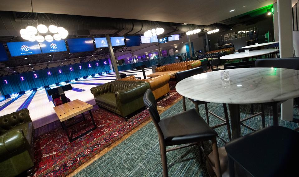 Chesterfield sofas and Oriental rugs bring a feeling of comfort to the 10-lane bowling alley in the back of Highball Lanes, a full-serve restaurant with cuisine inspired by Hattiesburg restauranteur Robert St. John. The bowling alley in the Fondren District restaurant in Jackson, Miss., seen Tuesday, Jan. 25, 2022, includes custom-made cocktail tables using the lanes of the former Larwil Lanes in Jackson, which closed in 2008 after 44 years in operation.