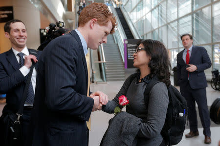 Samira Asgari is greeted U.S. Congressman Joe Kennedy at Logan Airport after she cleared U.S. customs and immigration in Boston, Massachusetts, U.S. February 3, 2017. Asgari is an Iranian scientist who had obtained a visa to conduct research at Brigham and Women's Hospital and was twice prevented from entering the United States under President Trump's executive order travel ban. REUTERS/Brian Snyder