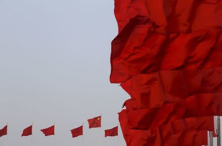Chinese national flags flutter at Tiananmen Square ahead of the opening session of the National People's Congress (NPC) in Beijing, China, March 5, 2016. REUTERS/Kim Kyung-hoon/File Photo