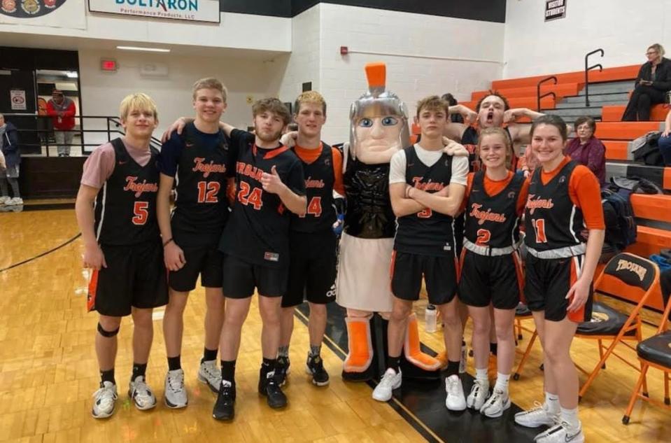 Trojans who jumped in and played so the Rockets would be able to go on with the game included Tanner Smith, Clayton Fish, Mason Sharrock, Watson Elder, Achilles the Trojan mascot, Damion Newkirk, Braelyn Fish, and Jaidyn Peoples and Jeremiah Caughy, in the back.