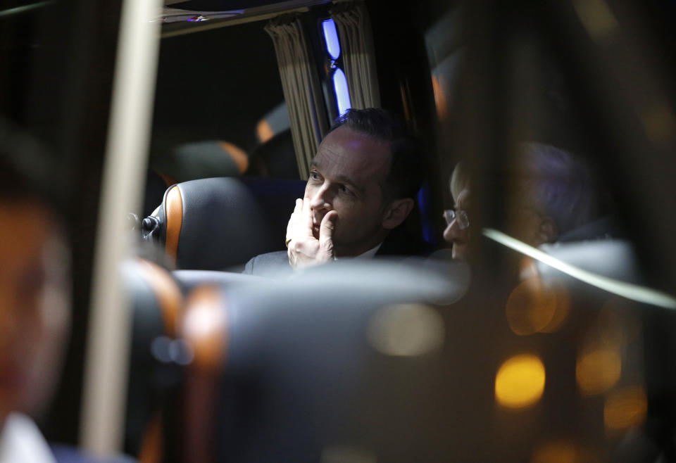 German Foreign Minister Heiko Maas sits in a minivan outside the hospital in Funchal, the capital of Portugal's Madeira Island, Thursday April 18, 2019 after visiting people injured in the bus crash. All the 29 people killed in a bus crash on Portugal's Madeira Island were German, Portugal's foreign ministry confirmed Thursday. The bus carrying 55 people, all but two of them German tourists, rolled down a steep hill after veering off the road on a bend east of Madeira's capital, Funchal, on Wednesday evening when it was still light and in fine weather. (AP Photo/Armando Franca)