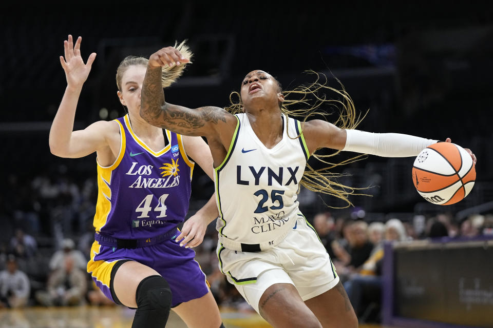 Minnesota Lynx guard Tiffany Mitchell, right, is fouled as she tries to get by Los Angeles Sparks Karlie Samuelson during the first half of a WNBA basketball game Tuesday, June 20, 2023, in Los Angeles. (AP Photo/Mark J. Terrill)