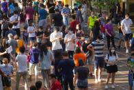 People queue up to vote in Hong Kong, Sunday, July 12, 2020, in an unofficial primary for pro-democracy candidates ahead of legislative elections in September. Over 200,000 Hong Kongers voted in an unofficial Hong Kong primary that will help the pro-democracy camp decide which candidates to field in legislative elections in September. The turnout exceeded organizers' estimates that some 170,000 people would turn up to vote over the weekend. (AP Photo/Vincent Yu)