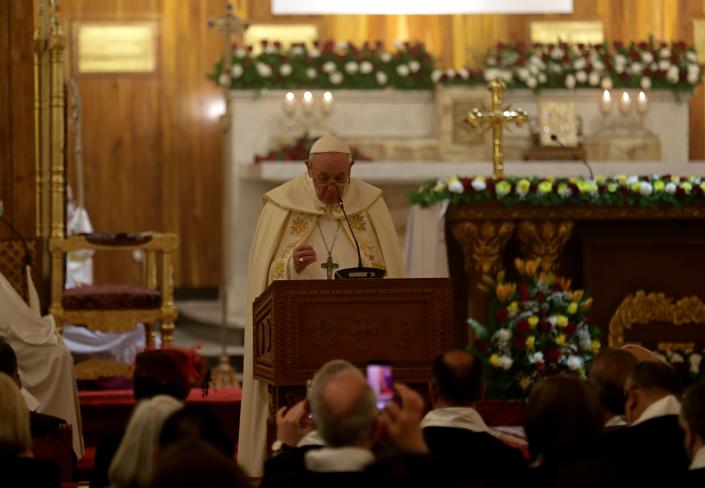 Pope Francis, center, leads a mass at Mar Youssef Church in Baghdad, Iraq, Saturday, March 6, 2021. Pope Francis and Iraq's top Shiite cleric delivered a powerful message of peaceful coexistence Saturday, urging Muslims in the war-weary Arab nation to embrace Iraq's long-beleaguered Christian minority during an historic meeting in the holy city of Najaf. (AP Photo/Khalid Mohammed)
