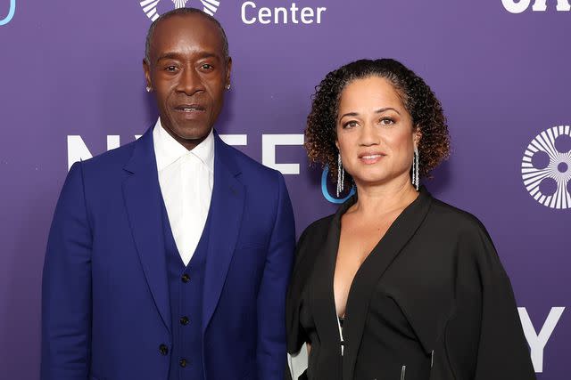 <p>Monica Schipper/Getty</p> Don Cheadle and Bridgid Coulter in 2022