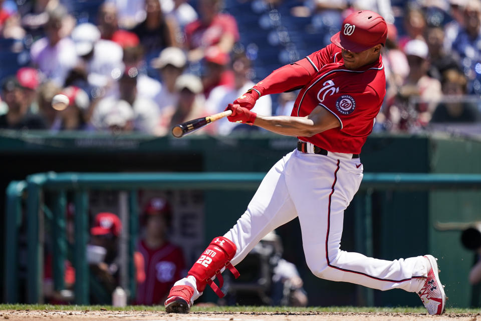 Washington Nationals' Juan Soto hits an RBI double during the second inning of a baseball game against the Pittsburgh Pirates at Nationals Park, Wednesday, June 29, 2022, in Washington. (AP Photo/Alex Brandon)