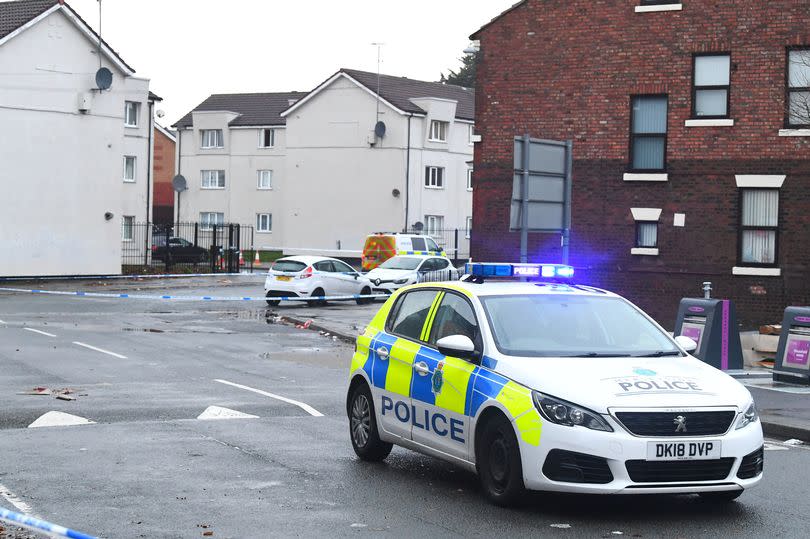 Police at the cordoned off scene on Upper Warwick Street, Toxteth