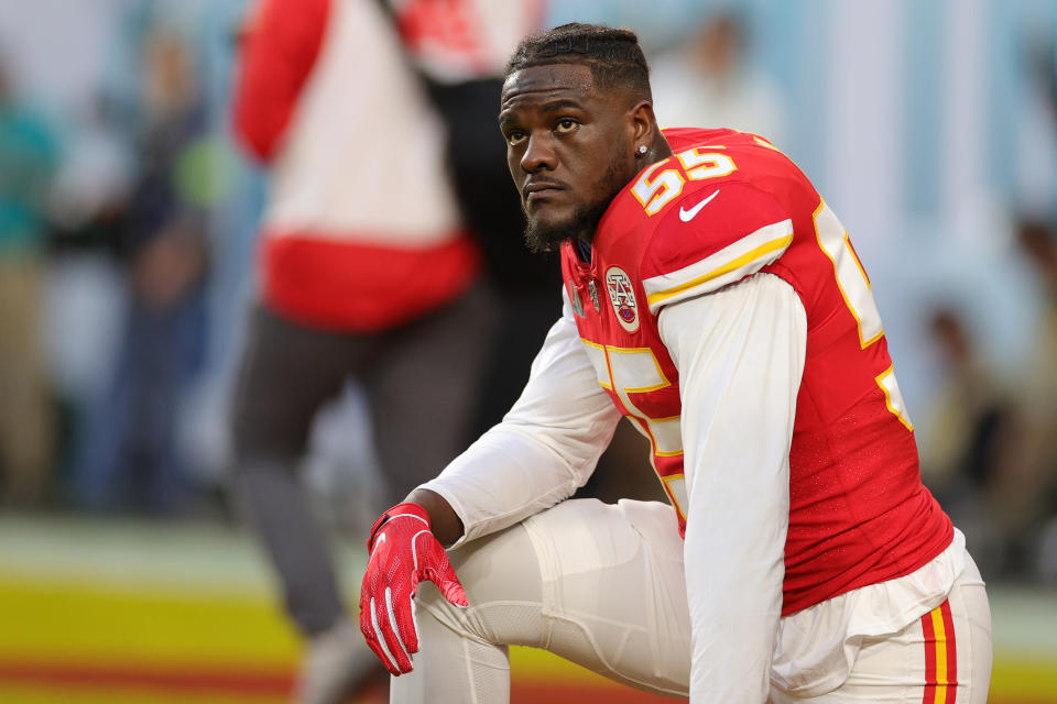 Frank Clark of the Kansas City Chiefs knees before in Super Bowl LIV at Hard Rock Stadium on February 02, 2020, in Miami, Florida.