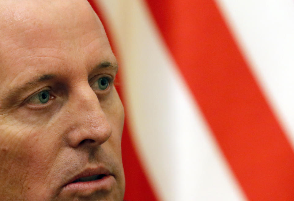 U.S President Donald Trump's envoy for the Kosovo-Serbia dialogue, Ambassador Richard Grenell, listens to Serbian President Aleksandar Vucic during a meeting in Belgrade, Serbia, Thursday, Oct. 10, 2019. Grenell is meeting officials in Belgrade as part of a renewed effort to restart negotiations and resolve decades-long disputes between former war foes. (AP Photo/Darko Vojinovic)