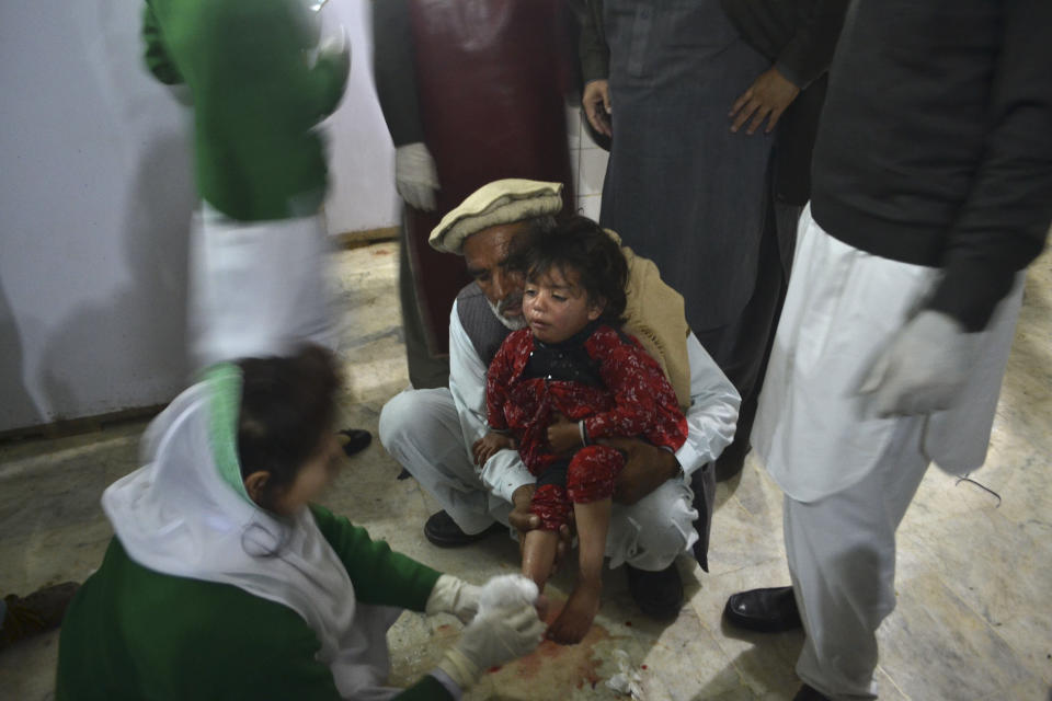 A Pakistani child who was wounded in a suicide bombing receives treatment at a hospital in Peshawar, Pakistan, Tuesday, Feb. 4, 2014. A suicide bomber killed many people in northwestern Pakistan Tuesday just hours after peace talks between government negotiators and a team representing the Pakistani Taliban were delayed, officials said. (AP Photo/Mohammad Sajjad)