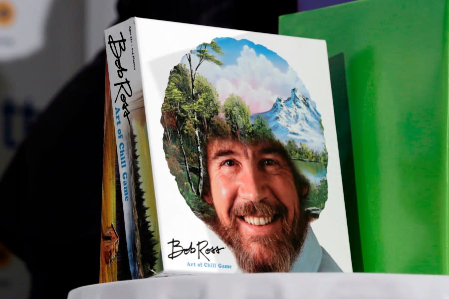 FILE – In this April 26, 2018 file photo, The Bob Ross “Art of the Chill Game,” by Big G Creative, is displayed at the TTPM 2018 Spring Showcase, in New York. Ross was known for his unpretentious approach to painting on his long-running show, “The Joy of Painting,” but now the painting he completed on his first show in 1983 is for sale for nearly $10 million. Minneapolis gallery owner Ryan Nelson calls it the ‘rookie card’ for Ross. (AP Photo/Richard Drew)