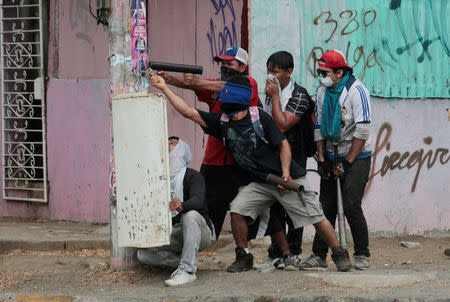 A demonstrator fires a homemade mortar towards riot police during a protest over a controversial reform to the pension plans of the Nicaraguan Social Security Institute (INSS) in Managua, Nicaragua April 21, 2018. REUTERS/Oswaldo Rivas