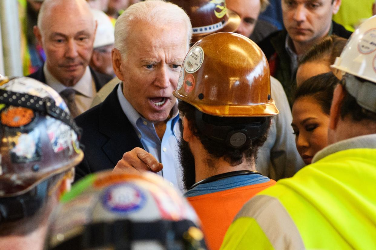 TOPSHOT - Democratic presidential candidate Joe Biden meets workers and discusses gun rights as he tours the Fiat Chrysler plant in Detroit, Michigan on March 10, 2020. (Photo by MANDEL NGAN / AFP) (Photo by MANDEL NGAN/AFP via Getty Images)