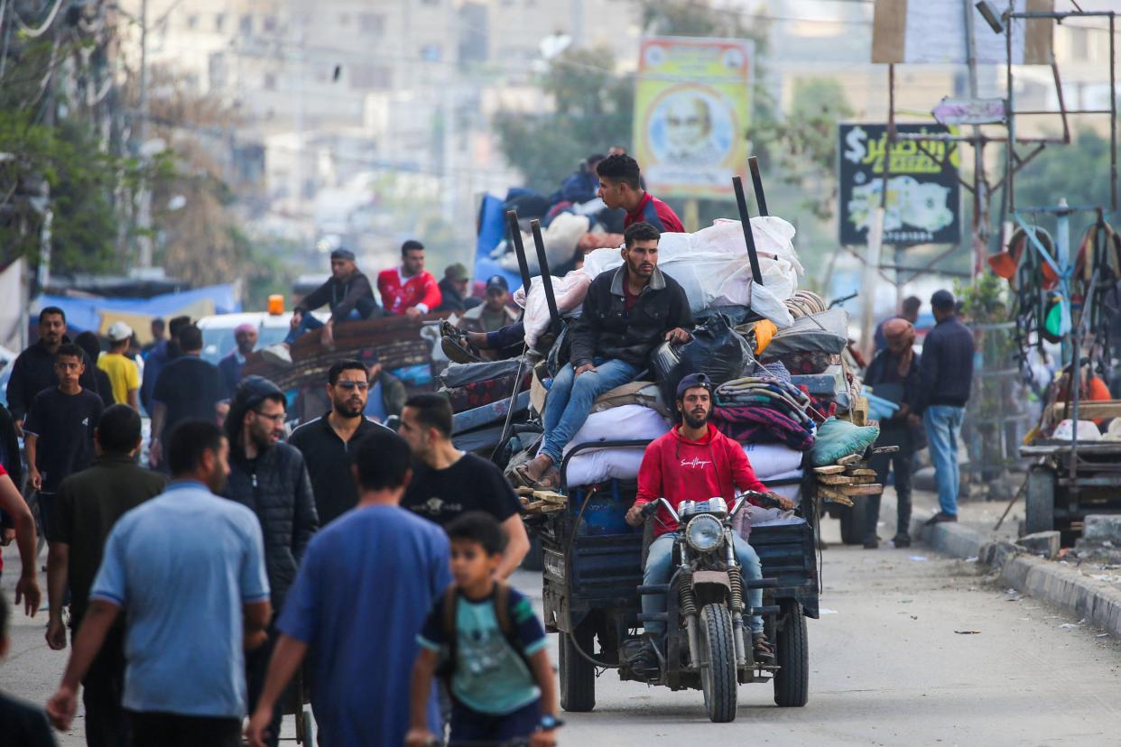 Displaced Palestinians flee Rafah with their belongings to safer areas in the southern Gaza Strip (AFP via Getty Images)