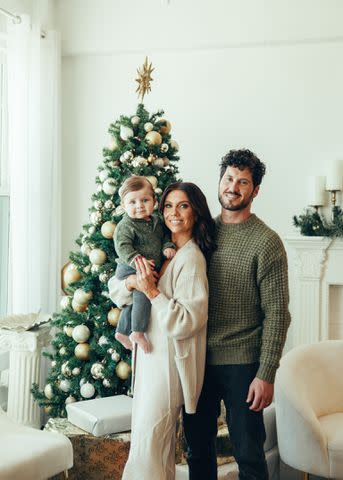 <p>Claire Lejeune/Shutterstock</p> Val Chmerkovskiy and Jenna Johnson celebrate first Christmas with son Rome