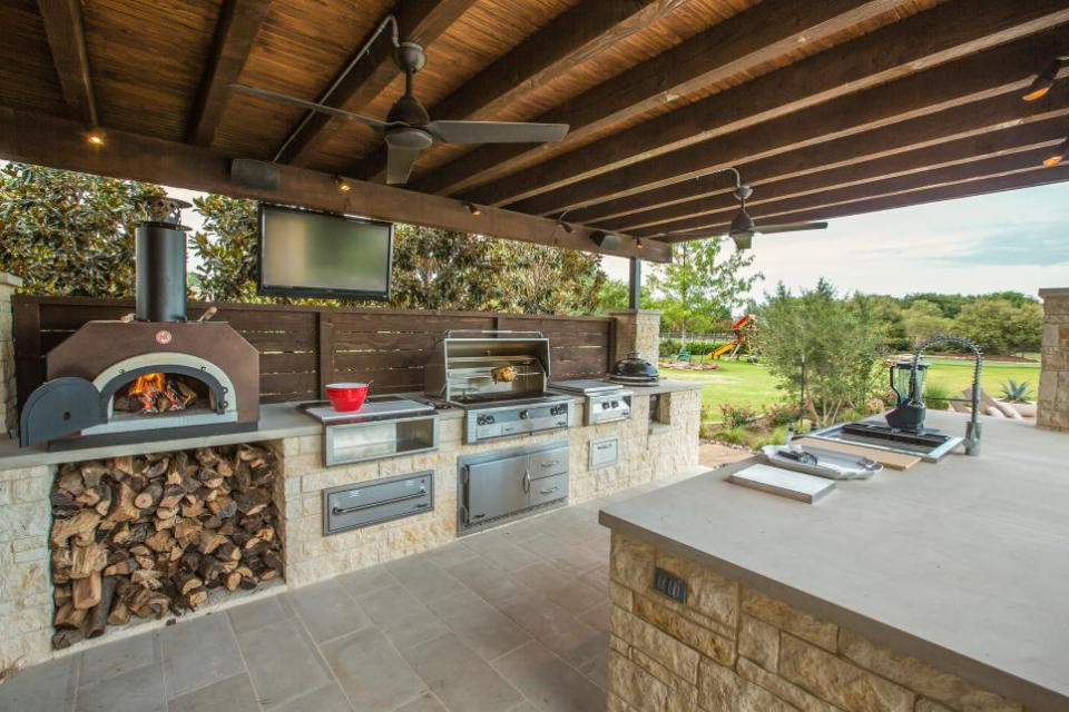 Large outdoor kitchen complete with ample grill and pizza oven space.