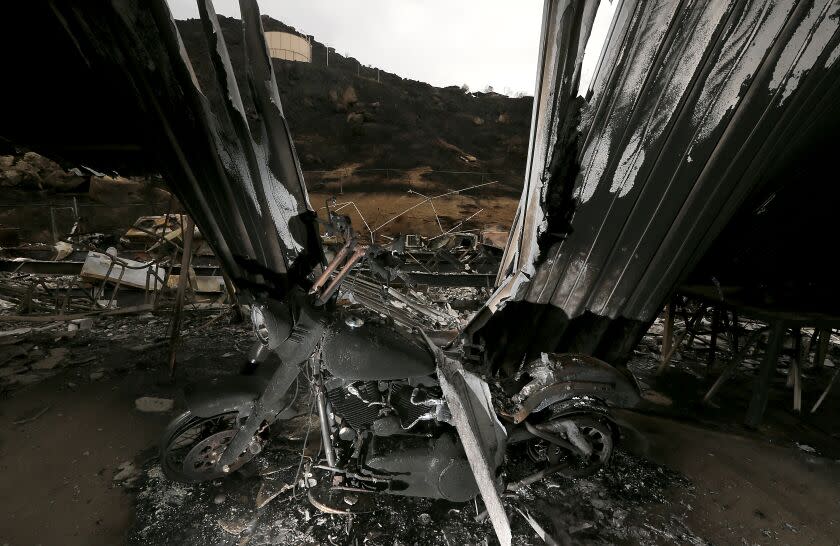 HEMET, CAL;IF. - SEP. 9, 2022. A charred motorcycle stands in a structure destroyed by the Fairview fire near Hemet on Friday, Sep. 9, 2022. Light rain and higher humidity gave firefighters a chance to get more containment around the fire, which has burned about 28,000 aces in and around the San Bernardino National Forest. (Luis Sinco / Los Angeles Times)