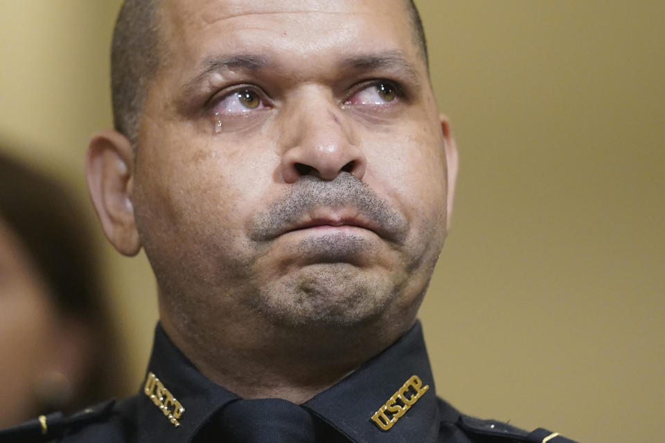U.S. Capitol Police officer Aquilino Gonell cries as he watches a video during the House Select Committee investigating the January 6 attack on the U.S. Capitol on July 27, 2021 at the Cannon House Office Building in Washington, DC.  / Credit: Andrew Harnik / Getty Images