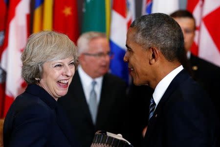 U.S. President Barack Obama (R) greets British Prime Minister Theresa May as he arrives for a luncheon during the United Nations General Assembly at United Nations headquarters in New York City, U.S. September 20, 2016. REUTERS/Lucas Jackson