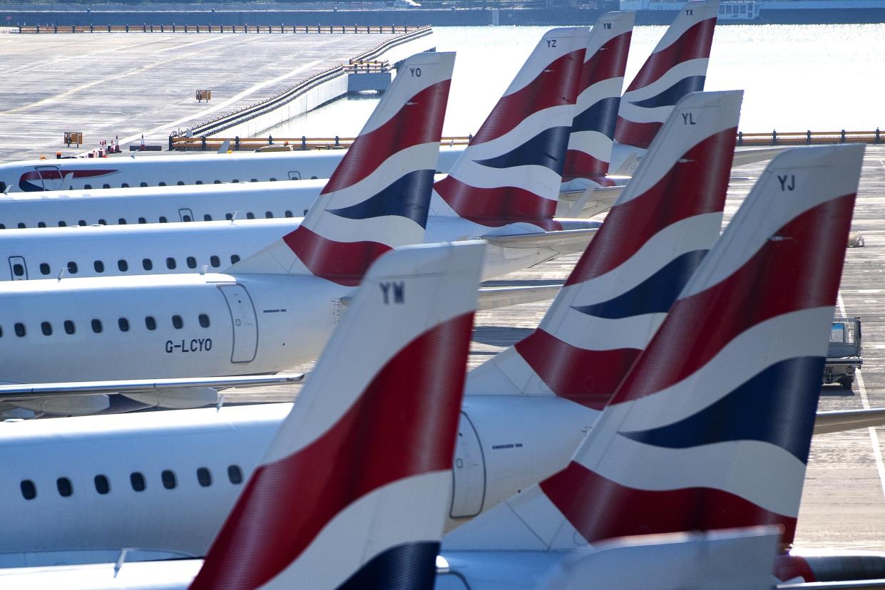 <p>Passengers prepare to board an easyJet flight to Faro, Portugal, at Gatwick</p> (PA)