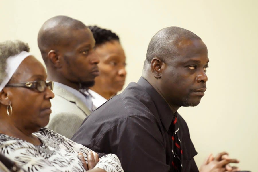 Eddie Terrell Parker, right, and Michael Corey Jenkins, center, listen as one of six former Mississippi law officers pleads guilty to state charges at the Rankin County Circuit Court in Brandon, Miss., Monday, Aug. 14, 2023. (AP Photo/Rogelio V. Solis)