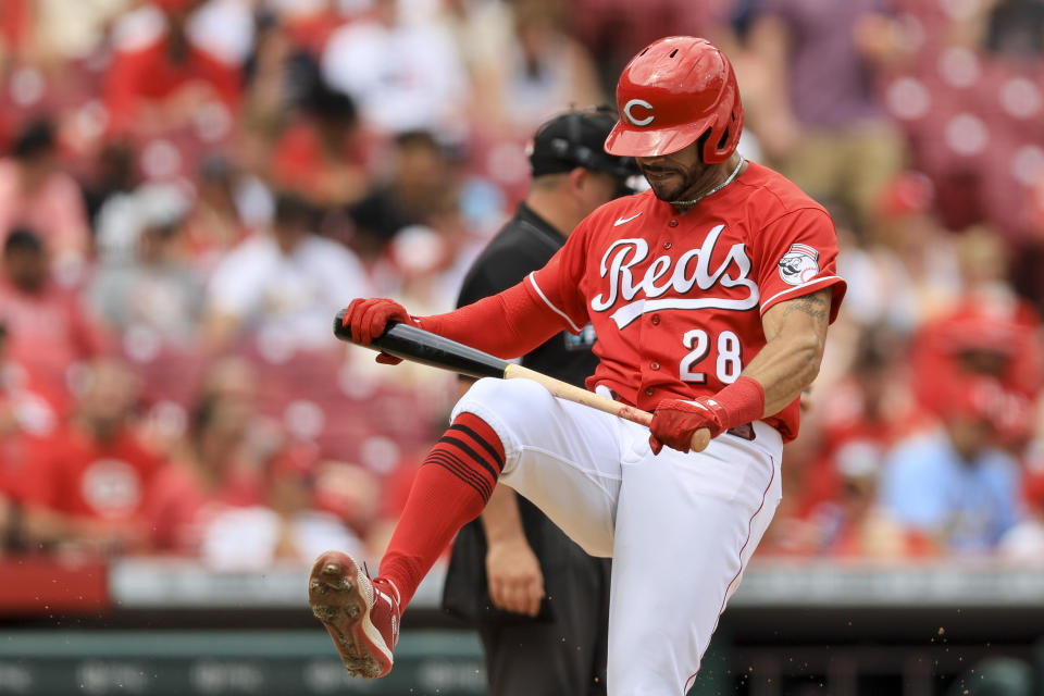 Cincinnati Reds' Tommy Pham attempts to break his bat after striking out during the fifth inning of a baseball game against the St. Louis Cardinals in Cincinnati, Sunday, July 24, 2022. (AP Photo/Aaron Doster)