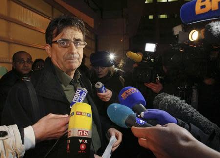 Deputy director Jean Marc Grenier talks to media outside the CHU Nord hospital in Grenoble, French Alps, where retired seven-times Formula One world champion Michael Schumacher is hospitalized after a ski accident, December 29, 2013. REUTERS/Robert Pratta