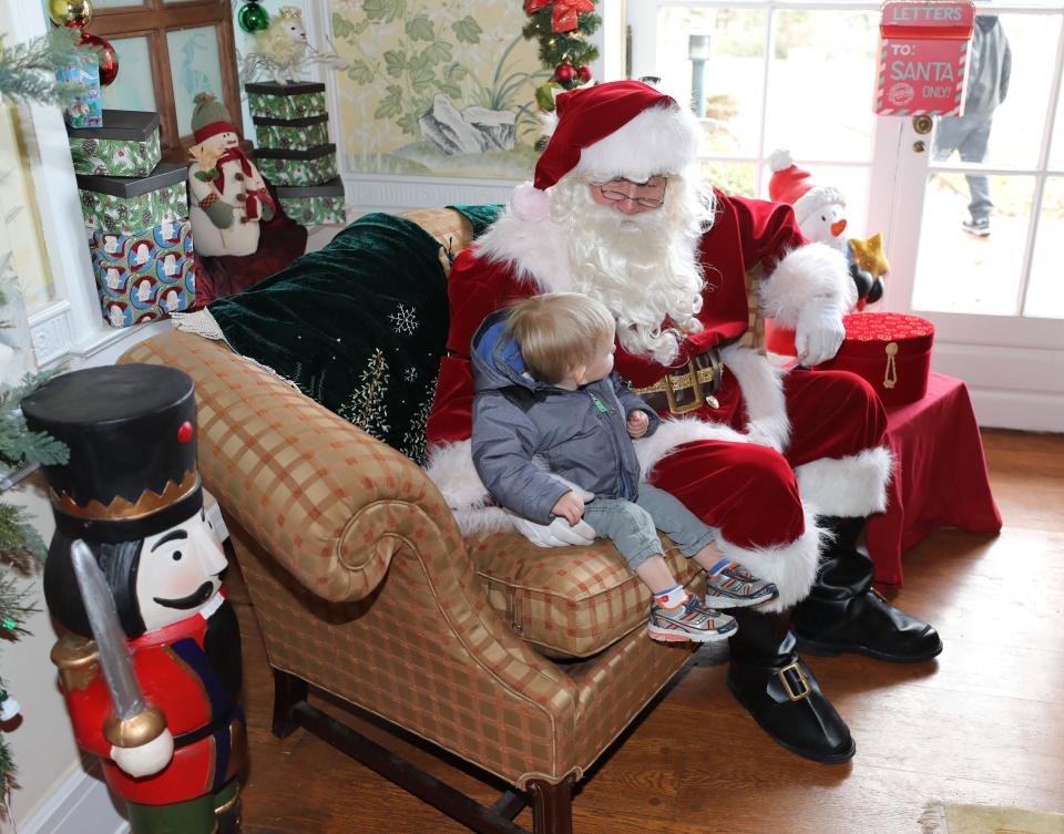 Santa greets Theo Cain, 1 1/2 years old from Sleepy Hollow, at the Holidays on the Hill exhibit at Lasdon Park and Arboretum in Katonah, Dec. 8, 2018.