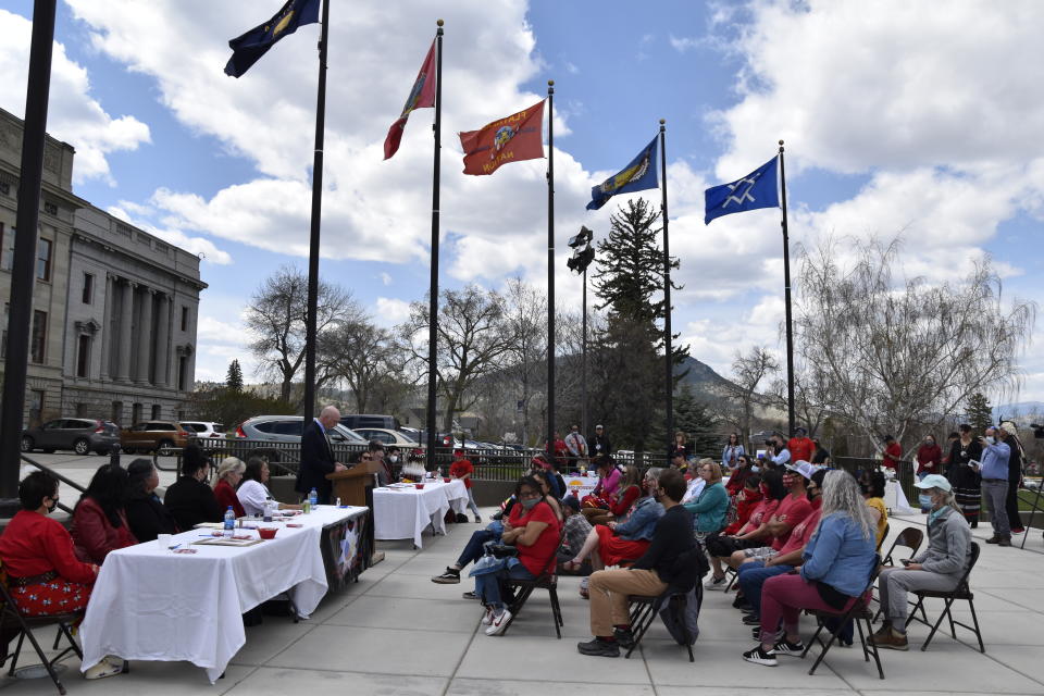 Montana Gov. Greg Gianforte addresses tribal members in front of the state Capitol in Helena, Mont., during a ceremony to commemorate missing and murdered indigenous people on Wednesday, May 5, 2021. From Washington to Indigenous communities across the American Southwest, top government officials, family members and advocates gathered Wednesday as part of a call to action to address the ongoing problem of violence against Indigenous women and children. (AP Photo/Iris Samuels)