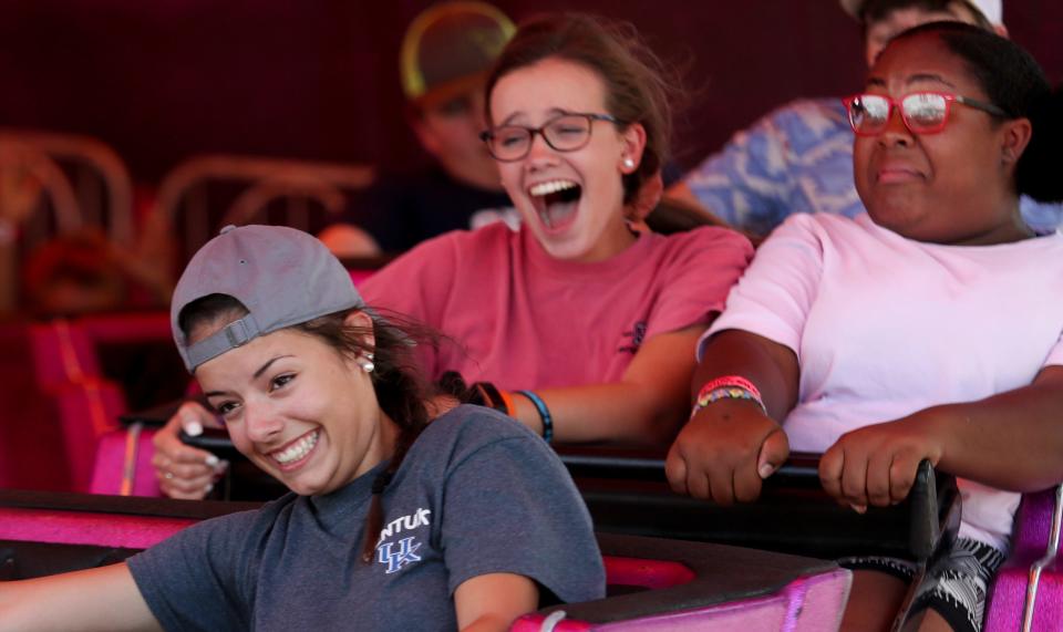 Fair attendees enjoy a ride on the Midway at the Kentucky State Fair on Friday.